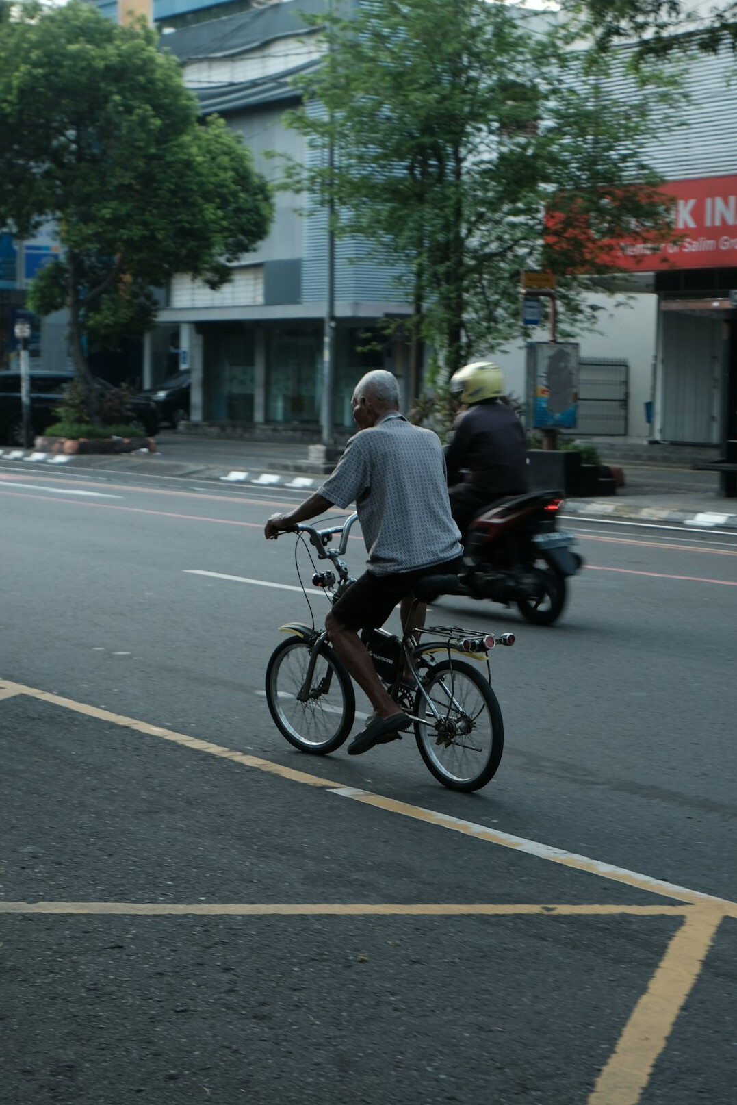 early morning city street with commuters
