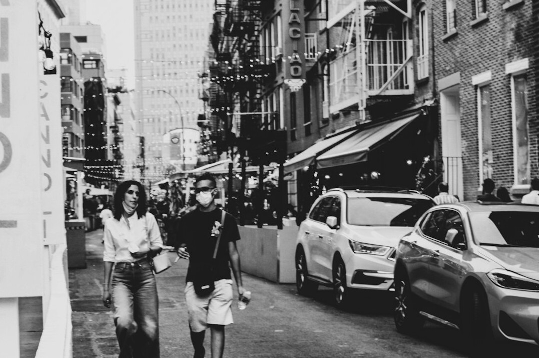 woman with children on city street