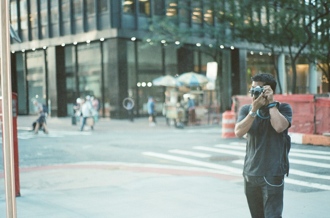 urban photographer capturing street scene
