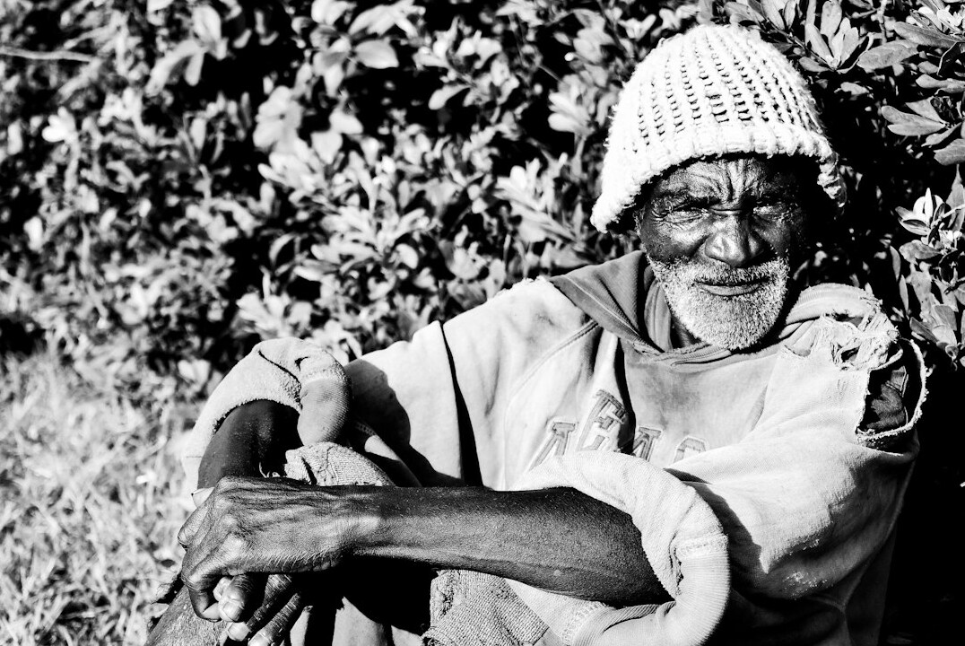 Portrait of an elderly woman smiling outdoors